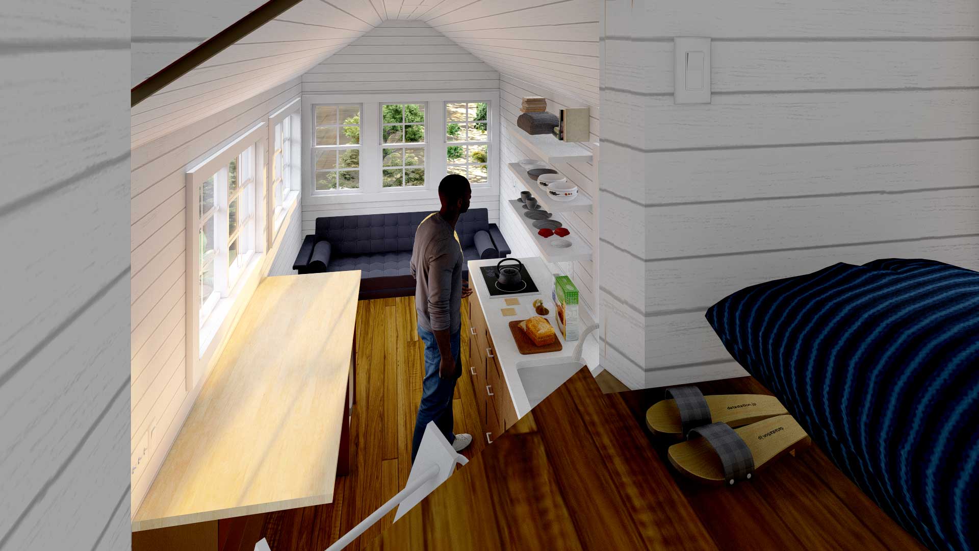 Person standing in the gooseneck loft of their Majesty tiny house