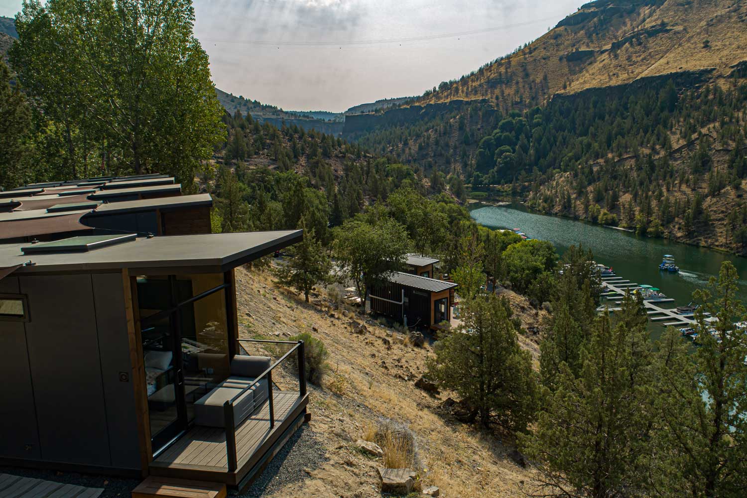 Exterior of an Oregon Tiny House hotel situated over a beautiful lake