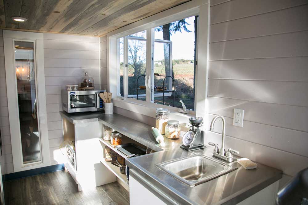 Kitchen and serving window of a custom tiny house donut shop and tiny home