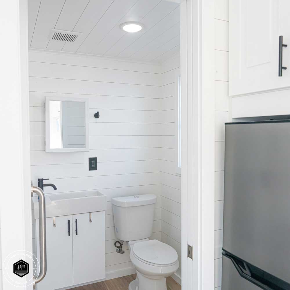 A shot of the bathroom of a Legacy tiny house in the farmhouse style