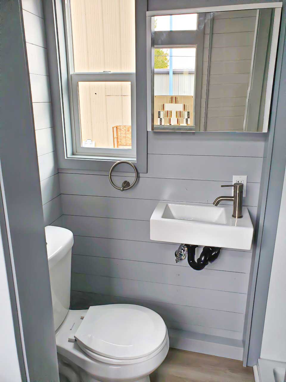 Bathroom in the True Blue custom tiny home