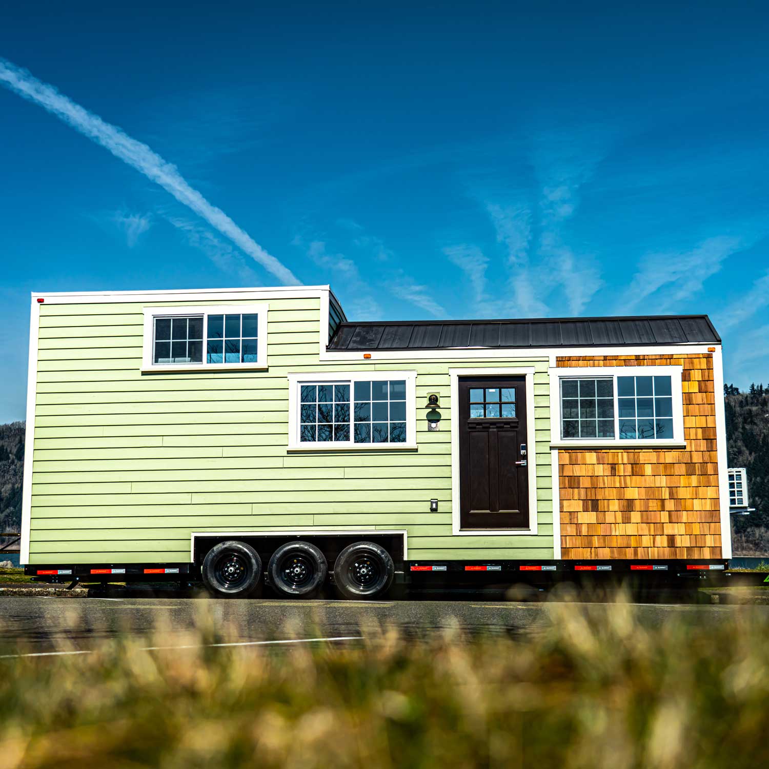 Outside photo of Heritage tiny home with blue sky in the background