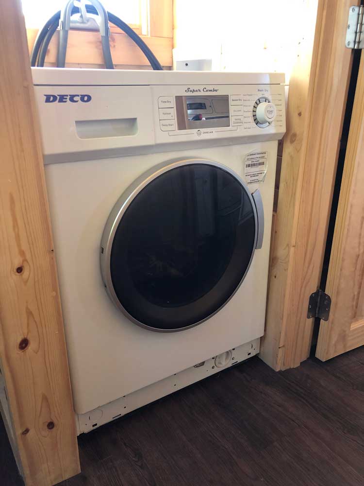 Washer dryer combo in the Contemporary Cottage custom tiny home