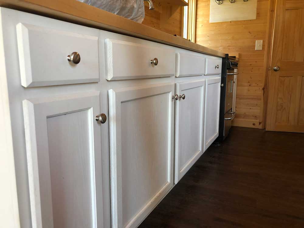 Kitchen cabinets in the Contemporary Cottage custom tiny home